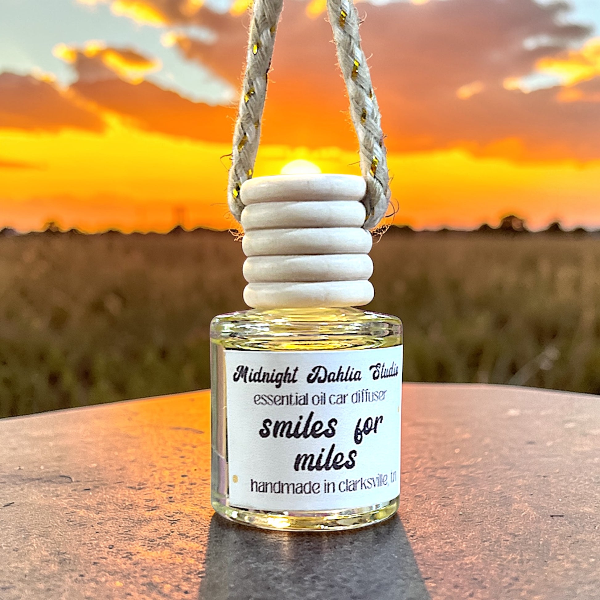 Essential oil diffuser bottle with sunset background