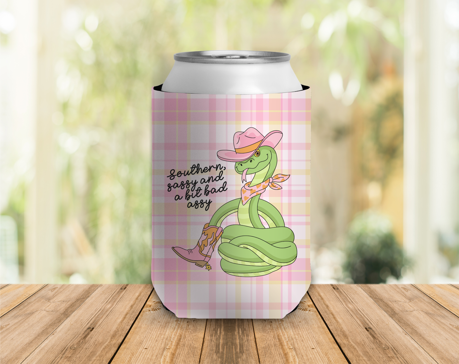 Can cooler with a cartoon snake design and text on a plaid background