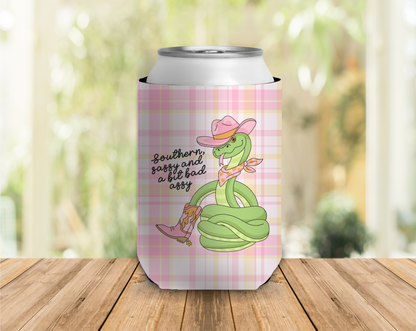 Can cooler with a cartoon snake design and text on a plaid background