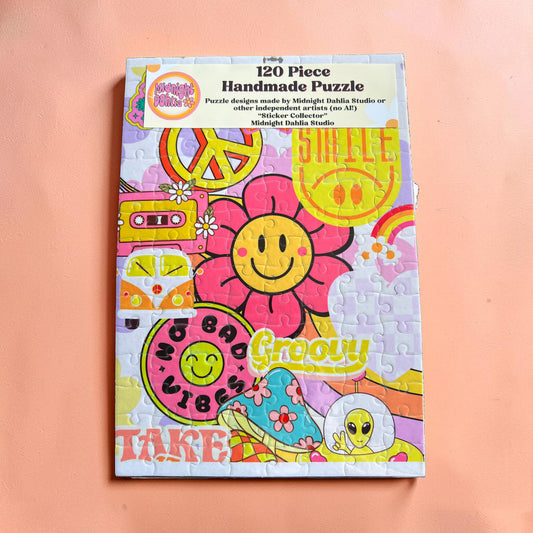 Colorful handmade puzzle packaging with smiley face design on a pink background