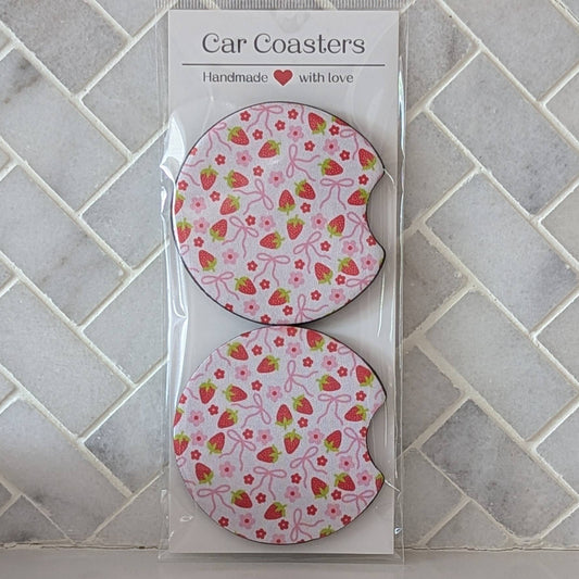 Packaged car coasters with strawberry pattern on a tiled wall background