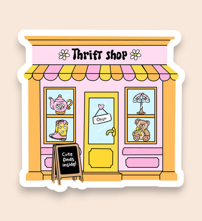 Illustration of a thrift shop with a pink facade and yellow trim.