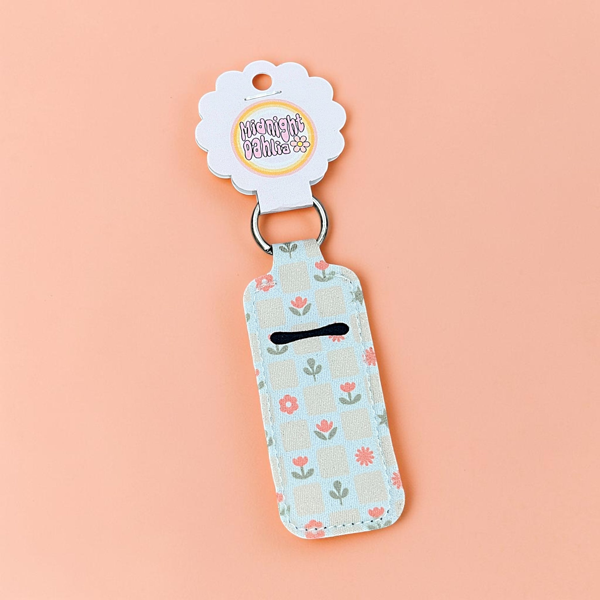 Keychain with floral pattern on a pink background
