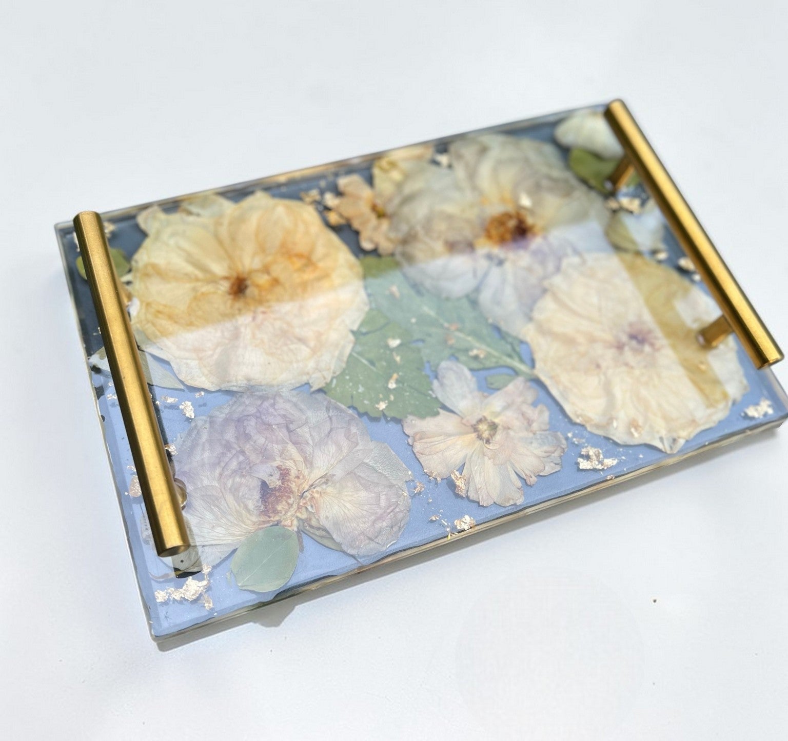 Decorative tray with floral design on a white background