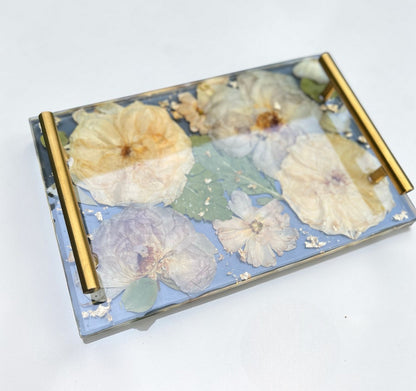 Decorative tray with floral design on a white background