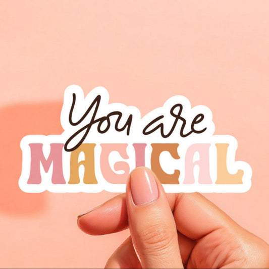 a white sticker that reads you are magical in black and colorful letters