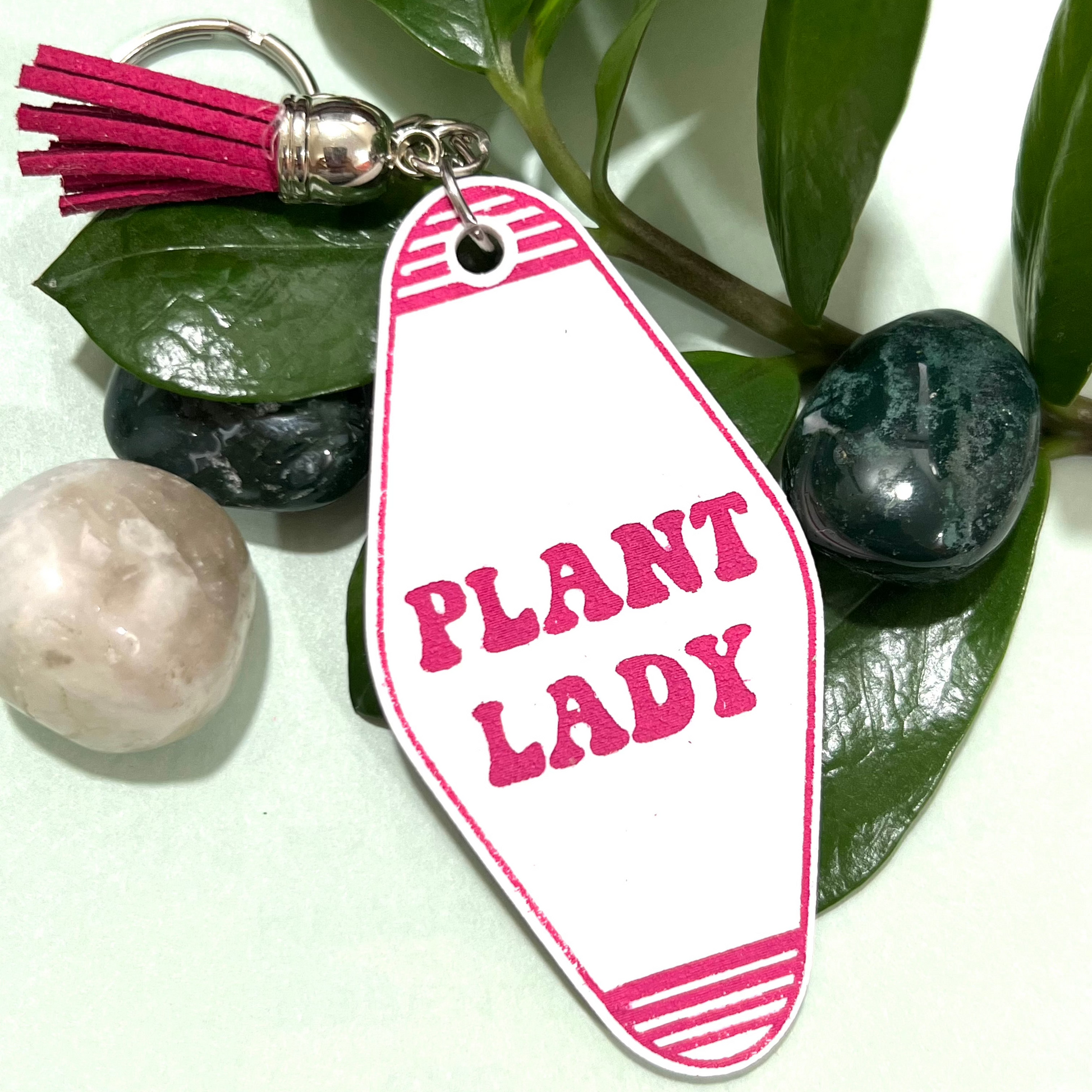 a retro motel keychain made of acrylic that reads plant lady